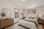 Step into this inviting bedroom, featuring a serene ambiance and stylish design.