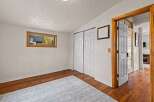Discover the charm of this inviting room, featuring beautiful hardwood floors and a cozy rug.