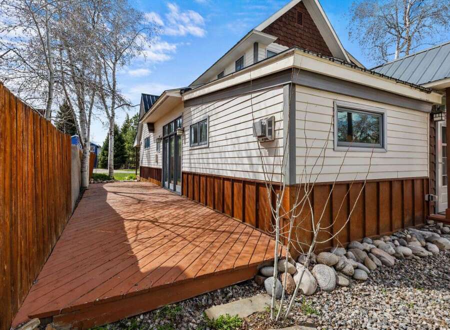 Discover the charm of this stunning property, featuring a beautifully designed exterior and a welcoming deck.