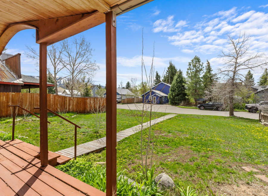 Step onto the inviting porch of this charming property and take in the serene surroundings.