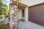 This charming property boasts a unique stone facade, creating a warm and inviting curb appeal.
