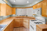 This stunning kitchen boasts beautiful wooden cabinetry, offering ample storage and a warm, inviting atmosphere.