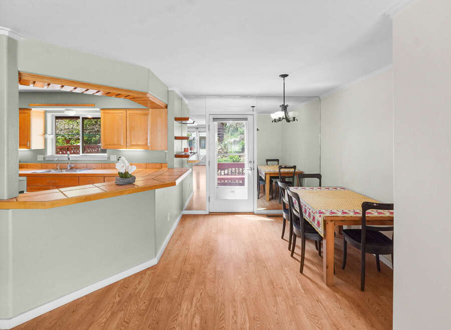 Step into this inviting home featuring a bright and airy dining area, perfect for entertaining.