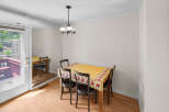 This charming dining area features a cozy table set for meals, perfect for intimate gatherings.