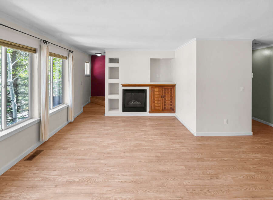 This stunning property boasts a spacious living area with beautiful hardwood floors and ample natural light.