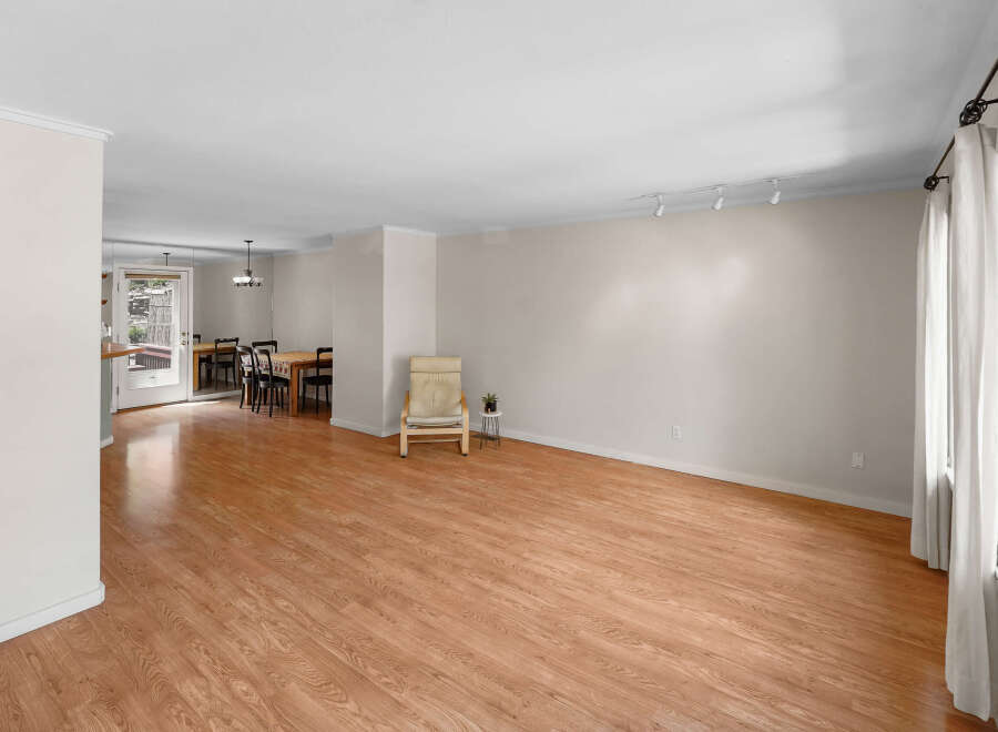 Step into this inviting living space, featuring beautiful hardwood floors and ample natural light.