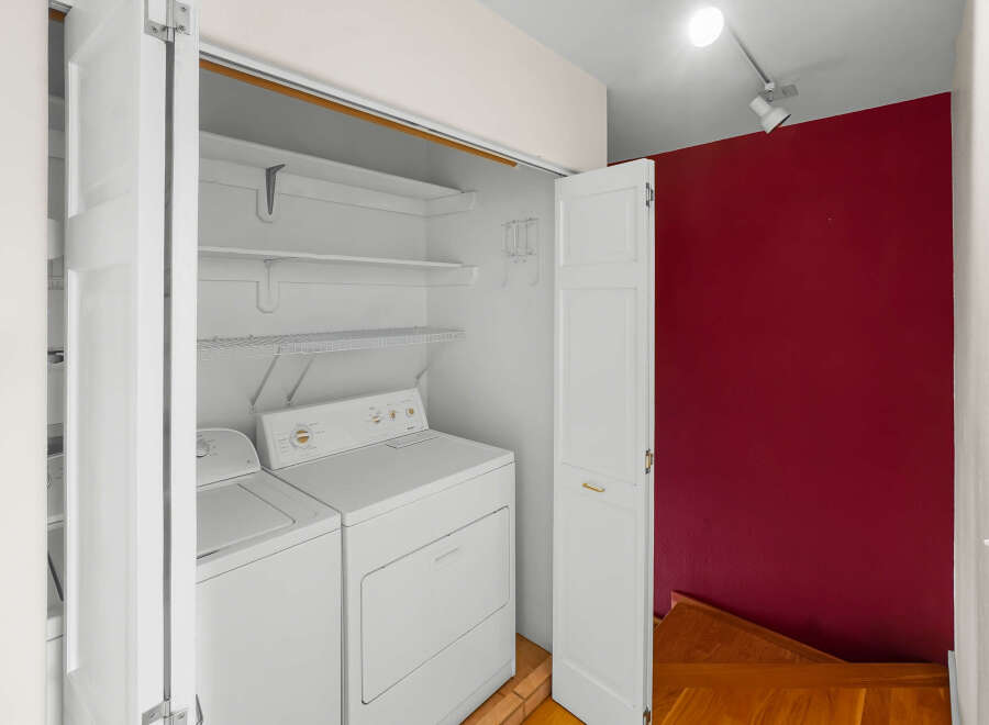 This laundry area features a washer and dryer set, offering convenience and functionality.