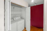 This laundry area features a washer and dryer set, offering convenience and functionality.
