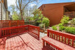 Enjoy outdoor living on this charming deck! This property features a beautifully designed deck with a vibrant red finish, perfect for entertaining or relaxing.