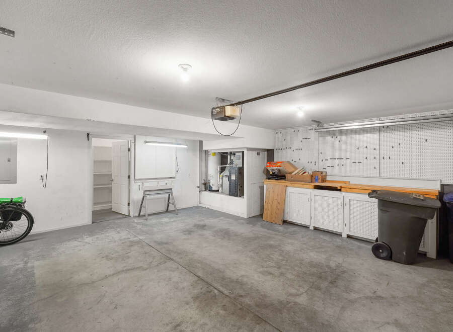 This spacious garage offers ample room for vehicles, storage, and projects.