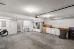 This spacious garage offers ample room for vehicles, storage, and projects.