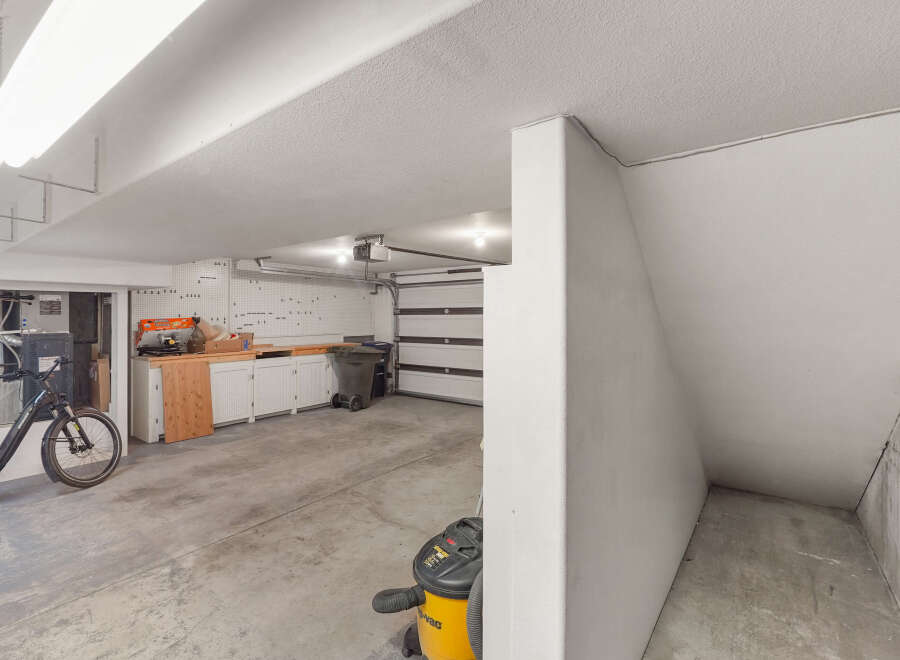 Discover the potential of this spacious garage, perfect for storage or a workshop.