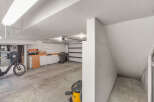 Discover the potential of this spacious garage, perfect for storage or a workshop.