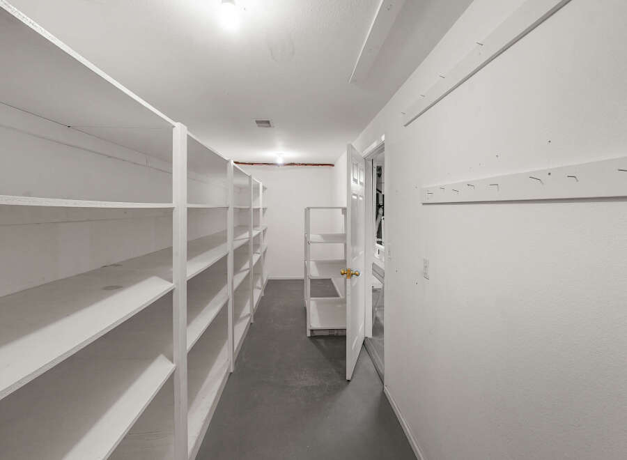 Explore this spacious storage room, perfect for organizing and decluttering your home.