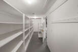 Explore this spacious storage room, perfect for organizing and decluttering your home.