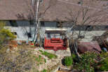 Discover this charming property featuring a vibrant red deck, perfect for outdoor gatherings.