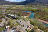 Discover the beauty of this stunning property, perfectly situated near a serene river and lush green landscapes.