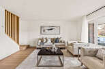 Step into this inviting living space, showcasing a blend of modern design and cozy comfort.