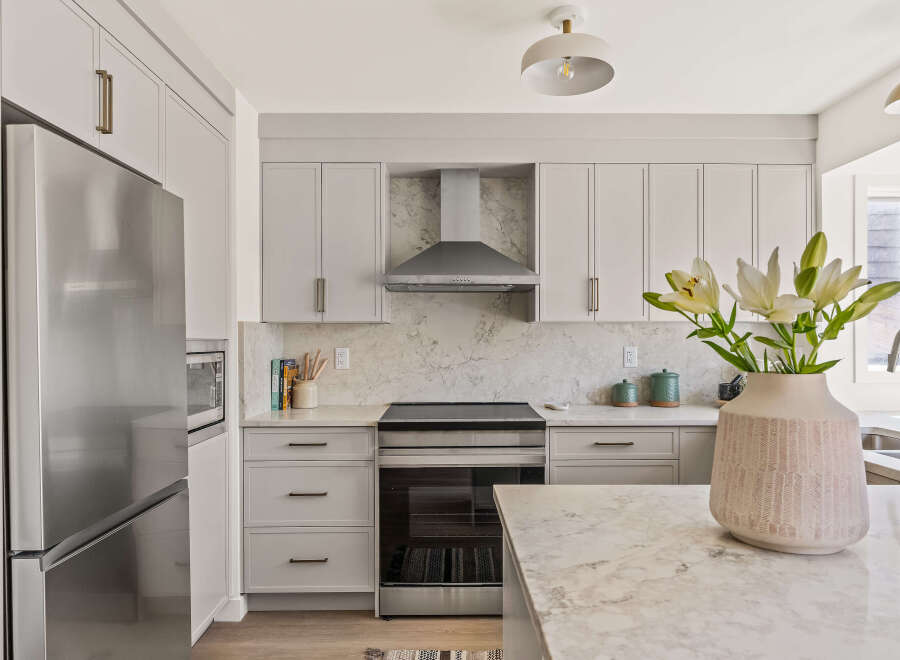 This stunning kitchen boasts a modern design with sleek cabinetry and stainless steel appliances.