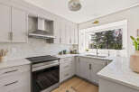 This stunning kitchen boasts modern design and functionality.