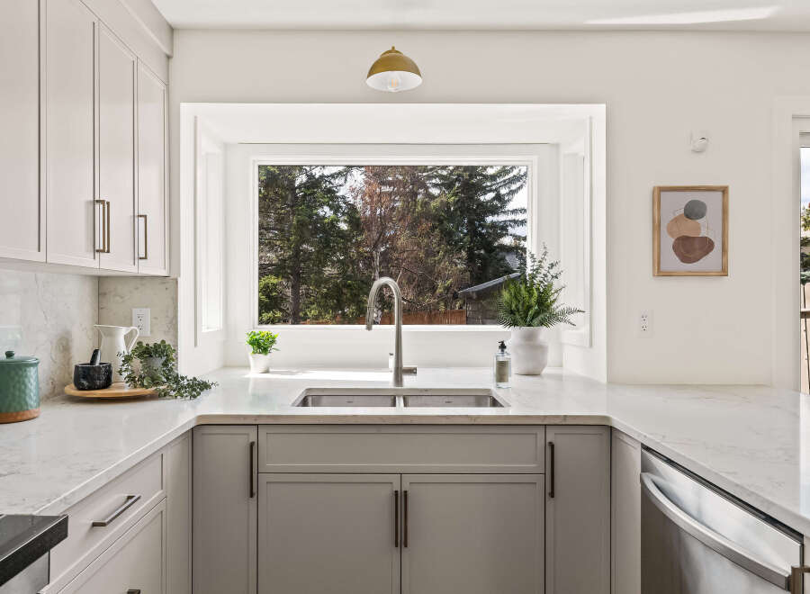 This stunning kitchen boasts a modern design with sleek cabinetry and elegant countertops.