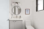 Step into this beautifully designed bathroom, featuring a modern vanity with ample storage and a sleek countertop.