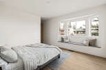 This stunning bedroom boasts a bright and airy atmosphere, perfect for relaxation.