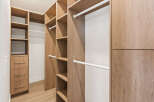 Step into luxury with this custom-designed walk-in closet, offering ample storage and organization.