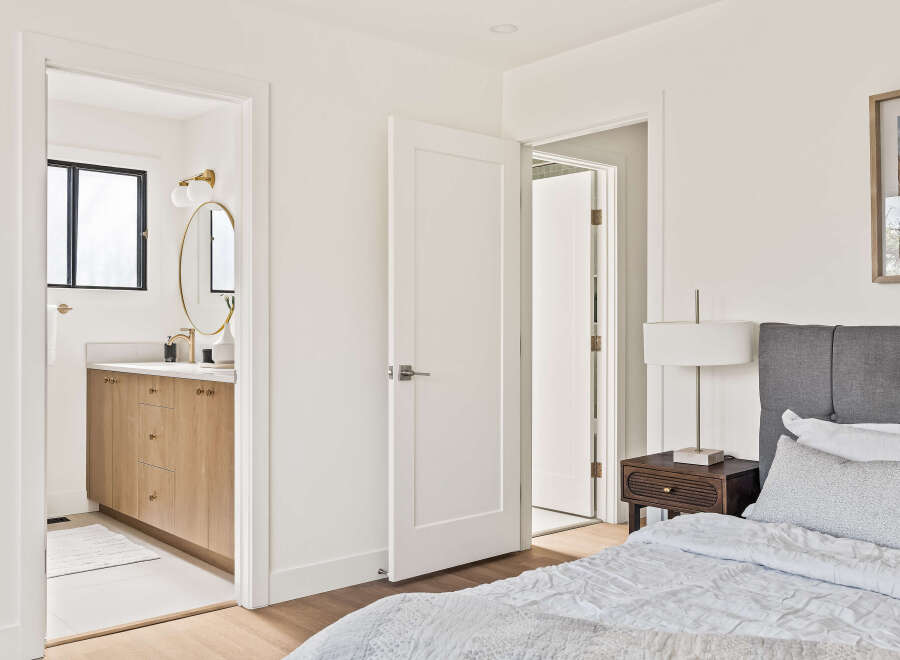 Step into this beautifully designed bedroom, featuring a seamless blend of modern and cozy elements.