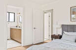 Step into this beautifully designed bedroom, featuring a seamless blend of modern and cozy elements.
