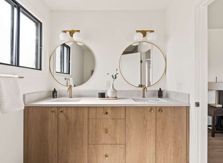 This stunning bathroom features a modern design with a double vanity.