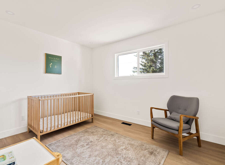 This charming nursery offers a serene and inviting space for your little one.
