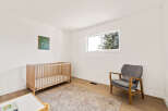 This charming nursery offers a serene and inviting space for your little one.