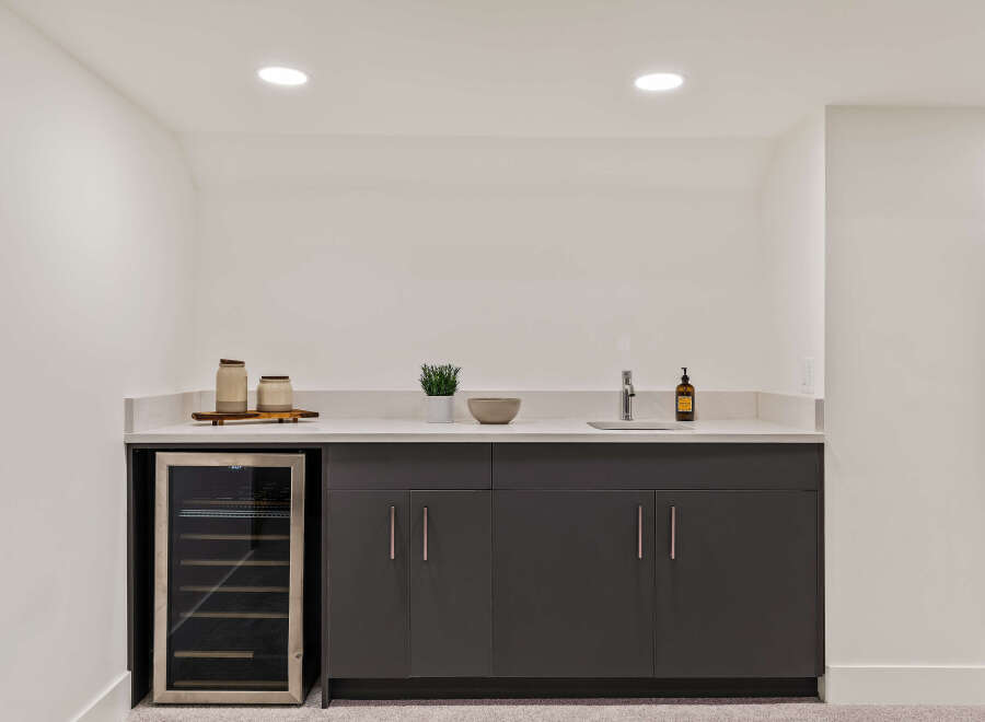 This stunning wet bar is the perfect addition to any home, offering both style and functionality.