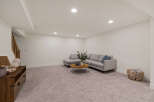 This inviting living space features a modern gray sectional sofa, perfect for relaxing and entertaining.