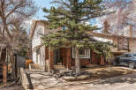 This charming two-story home boasts a classic brick facade and a welcoming entrance.