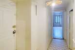 Step into this inviting property and discover a bright hallway leading to various rooms.