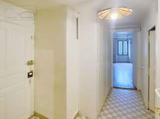 Step into this inviting property and discover a bright hallway leading to various rooms.
