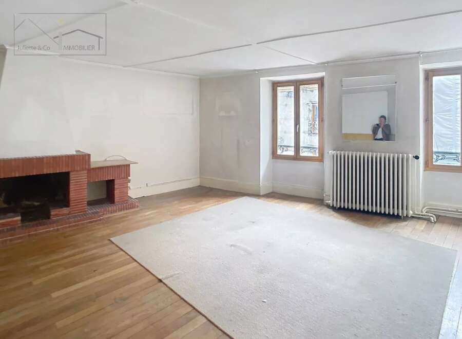 Discover the charm of this inviting property, featuring a spacious living area with a cozy fireplace.