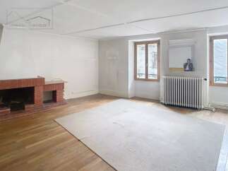 Discover the charm of this inviting property, featuring a spacious living area with a cozy fireplace.