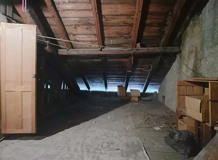 Explore the potential of this unfinished attic space, perfect for renovation or additional storage.