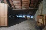 Explore the potential of this unfinished attic space, perfect for renovation or additional storage.