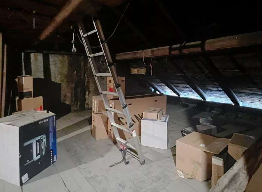 Discover the potential of this attic space, perfect for storage or renovation.