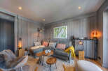 This cozy living space features a modern gray sectional sofa, perfect for relaxing.