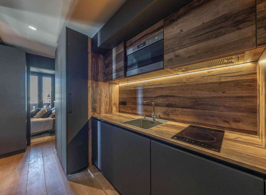 This stunning kitchen boasts a modern design with a warm, inviting feel.