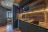 This stunning kitchen boasts a modern design with a warm, inviting feel.