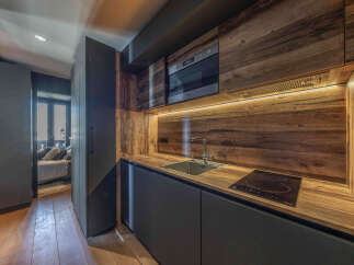 This stunning kitchen boasts a modern design with a warm, inviting feel.