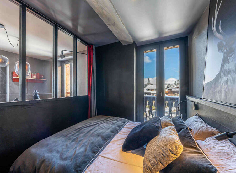 Experience the charm of this cozy bedroom with stunning mountain views.