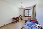 Discover this charming property featuring a cozy bedroom with a comfortable bed and a study area.