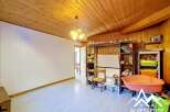 Discover this charming property featuring a cozy interior with wooden accents and a bright, inviting atmosphere.